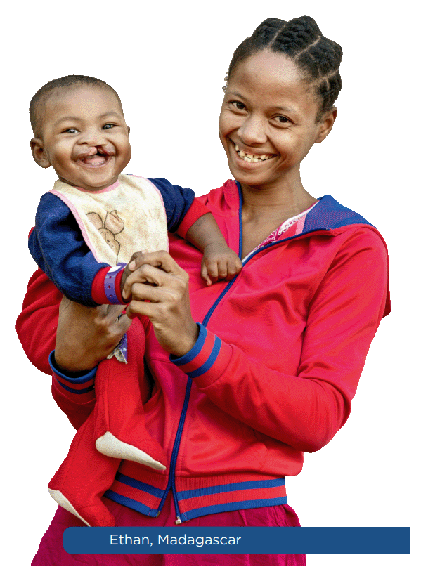 Mother holding her smiling child in Madagascar